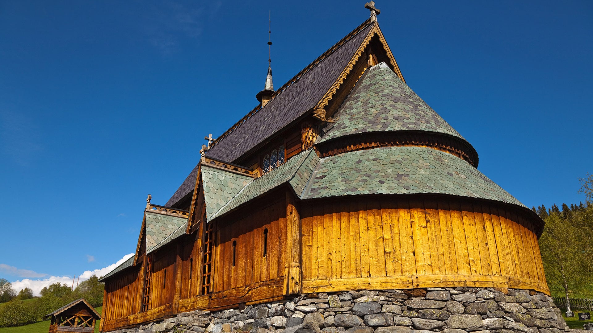 The stave church of Reinli on a sunny summer day.