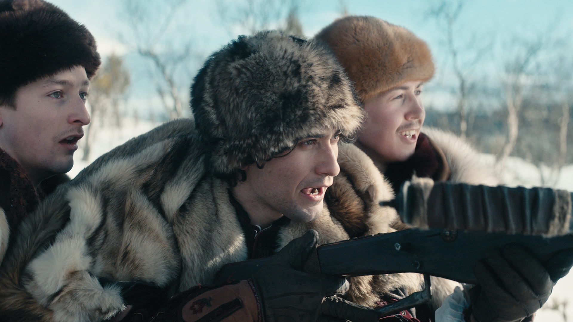 Three men wearing fur hats and coats hunting out in the snow from the movie Tre nøtter til Askepott.